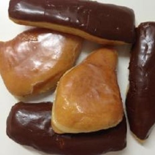 A plate of assorted donuts, including glazed and chocolate-covered varieties.