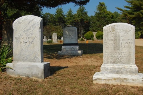 Gravestones in a cemetery, featuring inscriptions for George T. Brown (1842-1922) and another George Brown (1817-1852).