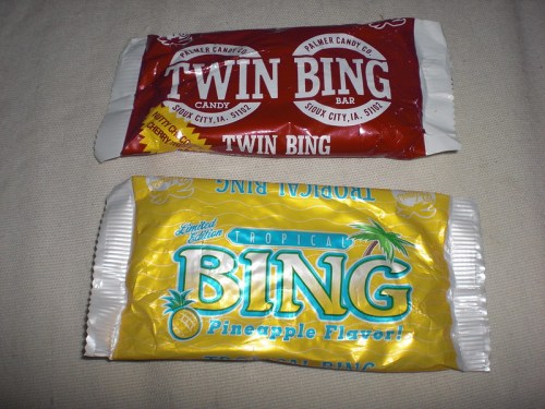 Two candy bars: a red Twin Bing bar on top and a yellow Tropical Bing bar with pineapple flavor below.