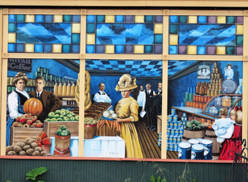 A colorful mural depicting a vintage grocery scene with people, fruits, and goods in a lively market setting.