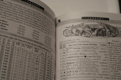 A close-up of a calendar page for January 2011, featuring dates, events, and illustrations.