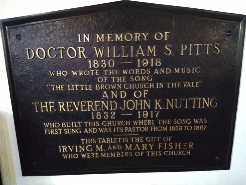 Plaque honoring Doctor William S. Pitts and Reverend John K. Nutting, detailing their contributions to a church.