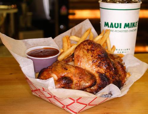 A basket of roasted chicken with fries and barbecue sauce, alongside a drink from Maui Mike's.