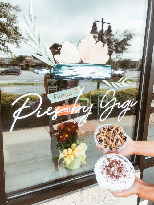 A person holds two dessert bowls in front of a shop window with "Pies by Gigi" and a floral arrangement.