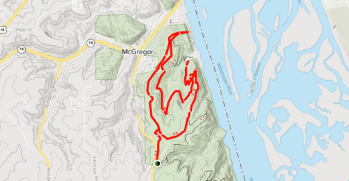 Map showing a winding trail in McGregor, marked in red, alongside a river and surrounding terrain.