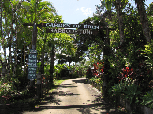 Entrance to the Garden of Eden Arboretum, featuring lush greenery and a welcoming sign for visitors.