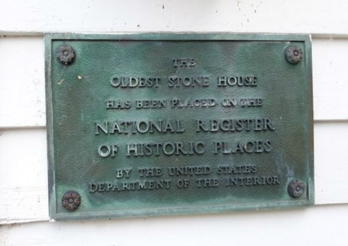 Plaque stating "The Oldest Stone House" is on the National Register of Historic Places by the U.S. Department of the Interior.