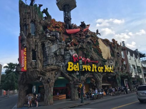 A whimsical building facade featuring animals and trees, with a sign reading "Ripley's Believe It or Not!" in bright colors.