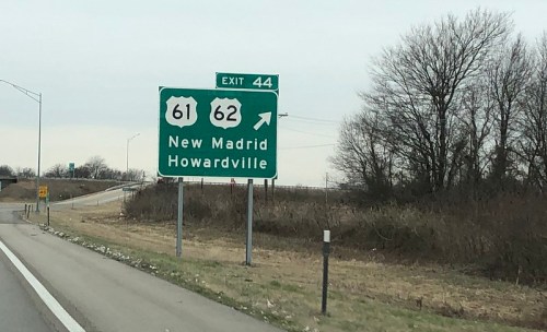 Highway exit sign for New Madrid and Howardville, indicating exits 44 for routes 61 and 62.