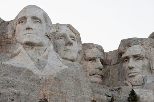 Mount Rushmore featuring the carved faces of George Washington, Thomas Jefferson, Theodore Roosevelt, and Abraham Lincoln.