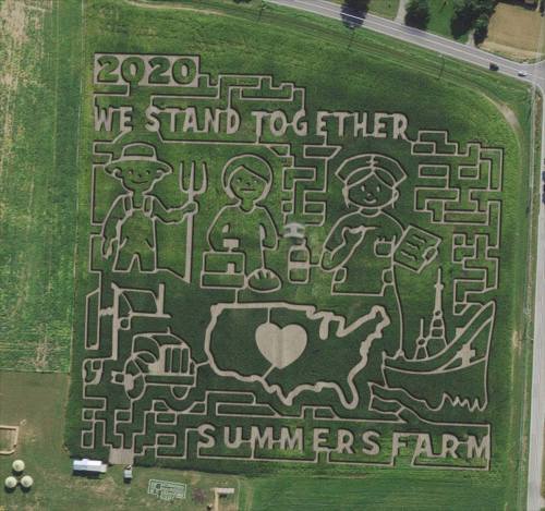 Aerial view of a corn maze featuring farm-themed designs and the text "2020 We Stand Together Summers Farm."
