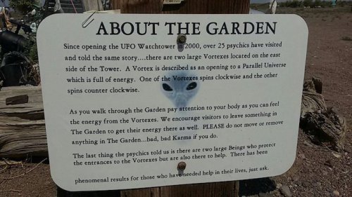 Sign about the UFO Watchtower garden, discussing vortexes and energy, encouraging visitors to connect with the space.