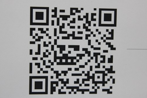 A black and white QR code on a white background.