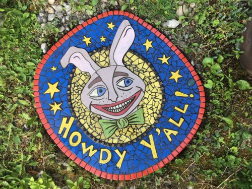 Colorful mosaic featuring a smiling rabbit with big ears and a bow tie, surrounded by stars and the text "Howdy Y'all!"