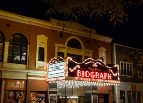 A brightly lit marquee of the Biograph Theater at night, featuring the title "If I Forget."