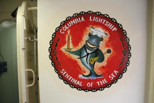 A colorful mural of a fish in a sailor's hat, with the text "Columbia Lightship, Sentinel of the Sea."