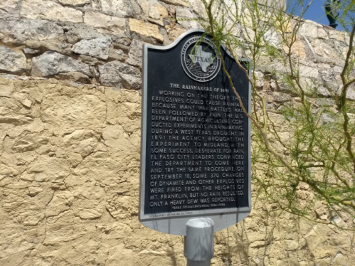 Historical marker about the Rainmakers of 1891, detailing their experiments and the agency's response to explosions.