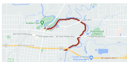 Map showing a highlighted route through Bartlesville, Oklahoma, including parks and major roads.