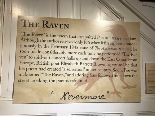Sign about "The Raven" by Edgar Allan Poe, detailing its impact and history, including mentions of Elizabeth Barrett Browning.