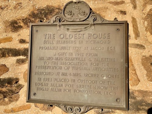 Historical plaque detailing the oldest house in Richmond, built in 1737, with information about its preservation.