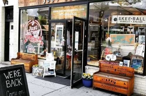 Exterior of "Just Jersey" store with wooden benches outside, showcasing local goods and a welcoming entrance.
