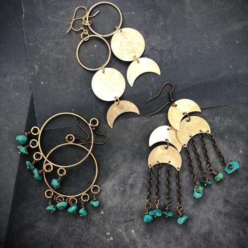Two pairs of earrings: one with circular gold hoops and the other with crescent shapes and turquoise beads.