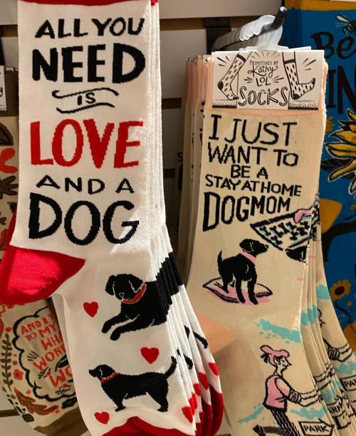 Two pairs of socks: one with "All you need is love and a dog" and the other "I just want to be a stay-at-home dog mom."