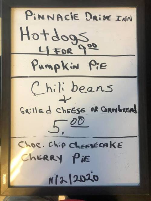 Menu board at Pinnacle Drive Inn: Hotdogs 4 for $9, Pumpkin Pie, Chili Beans, Grilled Cheese or Cornbread $5, Desserts.