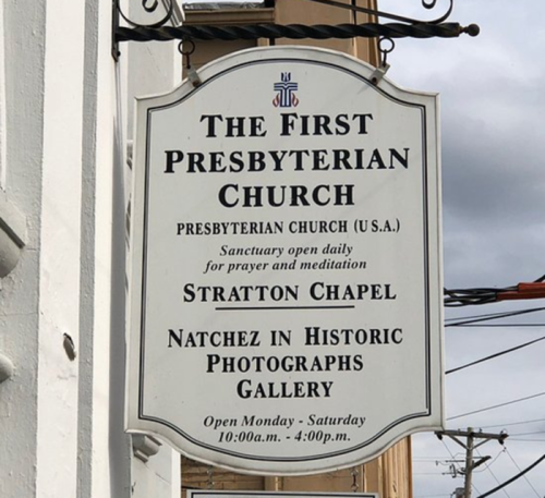 Sign for The First Presbyterian Church, detailing hours and information about the Stratton Chapel and gallery.