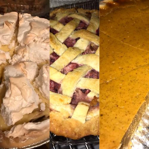 Three delicious pies: a meringue pie, a lattice-topped fruit pie, and a smooth pumpkin pie, all freshly baked.