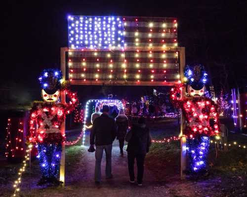 A festive entrance with nutcracker figures and colorful lights, leading to a pathway decorated for the holidays.