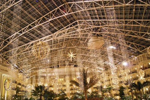 A beautifully decorated indoor space with hanging lights and ornaments, creating a festive atmosphere.