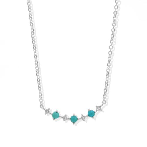 A silver necklace featuring five turquoise stones set in a delicate chain.