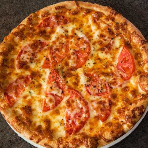 A freshly baked pizza topped with melted cheese and slices of tomato on a golden crust.