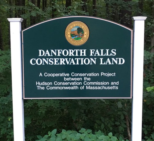 Sign for Danforth Falls Conservation Land, a cooperative project by the Hudson Conservation Commission and Massachusetts.