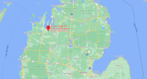 Map showing Timber Ridge RV & Recreation Resort location in northern Michigan, surrounded by forests and lakes.