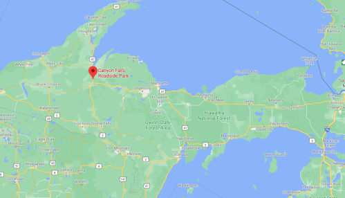 Map highlighting Canyon Falls Roadside Park in Michigan's Upper Peninsula, surrounded by green forested areas.