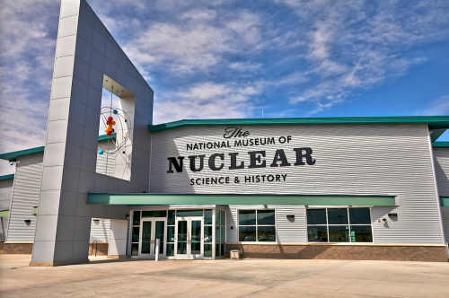 Exterior of the National Museum of Nuclear Science & History, featuring a modern design and clear blue sky.
