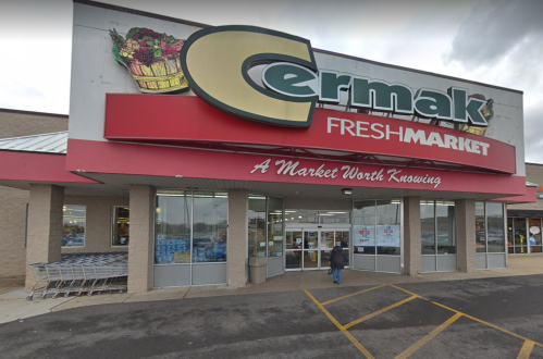 Exterior view of Cermak Fresh Market, featuring a large sign and shopping carts outside the entrance.