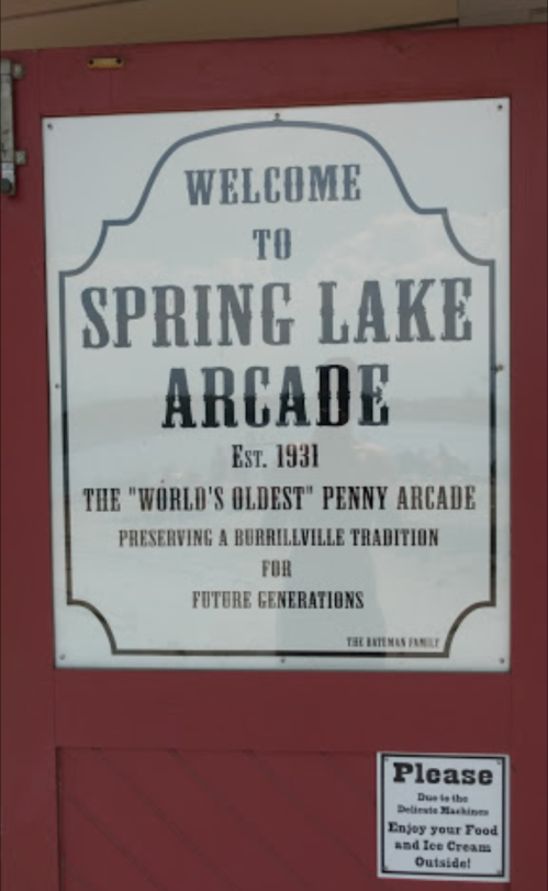 Sign welcoming visitors to Spring Lake Arcade, established in 1931, highlighting its status as the "world's oldest" penny arcade.