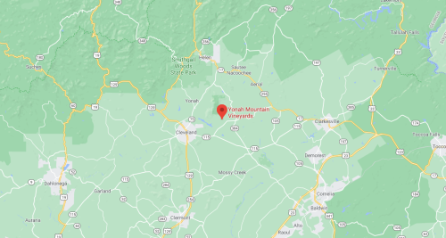Map showing the location of Yonah Mountain Vineyards in North Georgia, surrounded by green areas and roads.