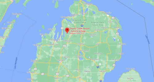 Map showing Shanty Creek Resort in Summit Village, Michigan, surrounded by green areas and nearby towns.