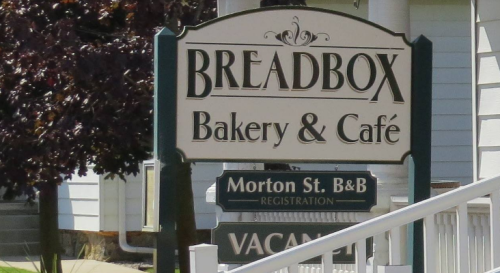 Sign for "Breadbox Bakery & Café" with additional information for Morton St. B&B registration and vacancy.