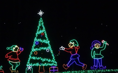 Colorful Christmas lights depicting a tree and three festive figures with gifts and decorations.