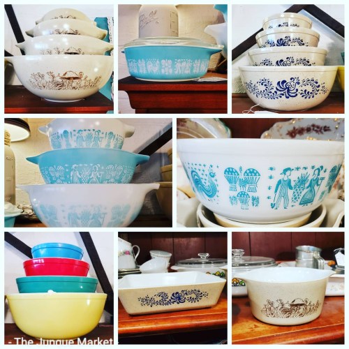 A collage of vintage bowls in various colors and designs, displayed on wooden shelves at a market.