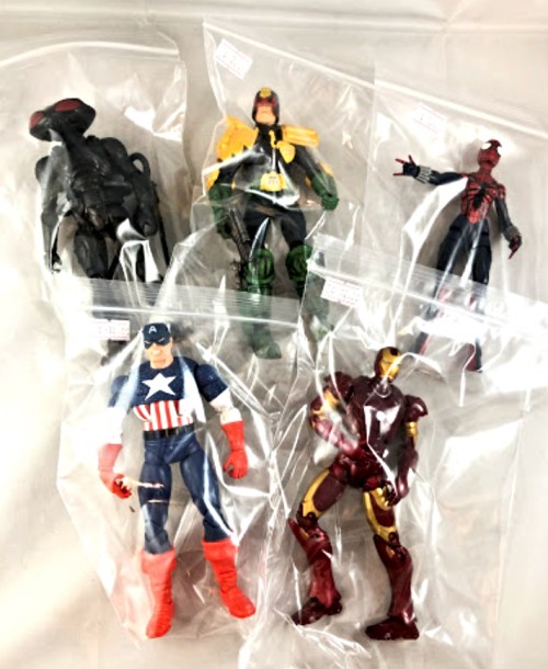 Five action figures in plastic bags: Spider-Man, Iron Man, Captain America, and two others.