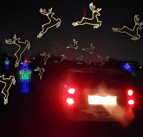 A car with glowing reindeer decorations in the night sky, surrounded by illuminated figures.
