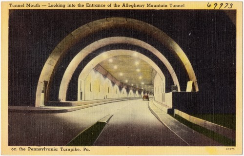 Vintage postcard of the Allegheny Mountain Tunnel entrance on the Pennsylvania Turnpike, featuring arched architecture.