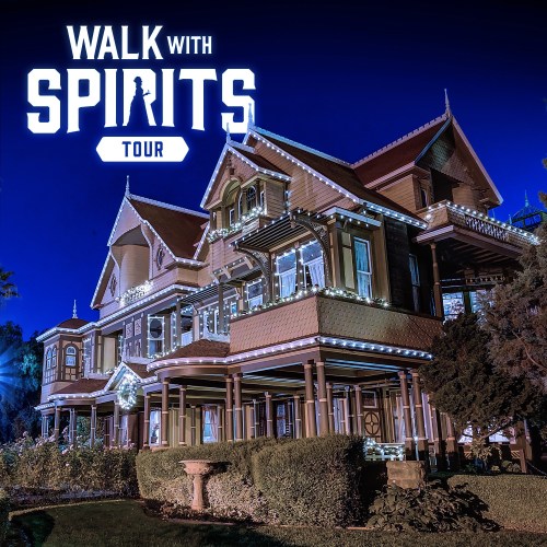 A beautifully lit historic house at night, featuring the text "Walk with Spirits Tour" above it.