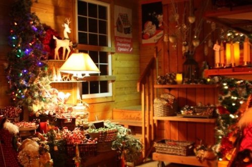 Cozy holiday scene with decorated walls, a lamp, and festive decorations, including candy canes and Christmas lights.